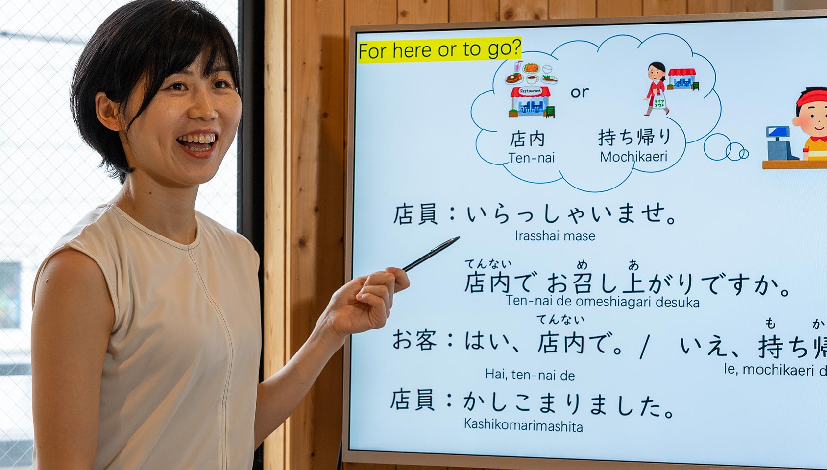 Teacher teaching private Japanese lessons on a whiteboard